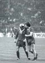 Terry McDermott and Emlyn Hughes share a quiet moment in victory against FC Bruges 