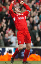 Jamie Carragher celebrates the Reds' derby victory