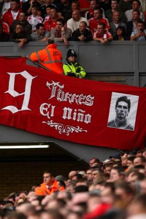 Liverpool fans hang a Fernando Torres banner