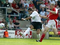 Milan Baros smashes home his second goal and Liverpool's fourth to wrap up a lively display in the pre season friendly at the Racecourse 